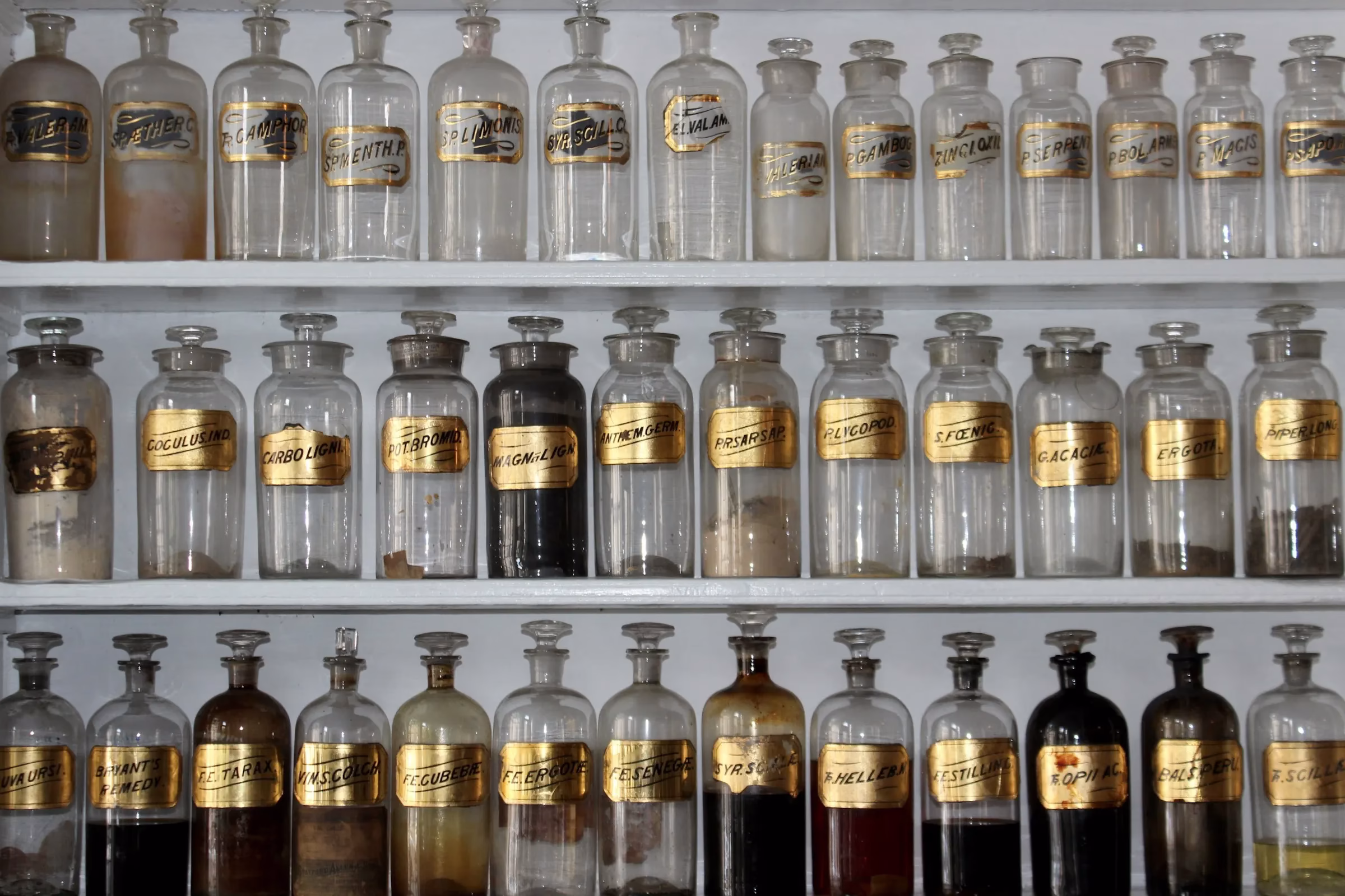 Shelves of old glass jars