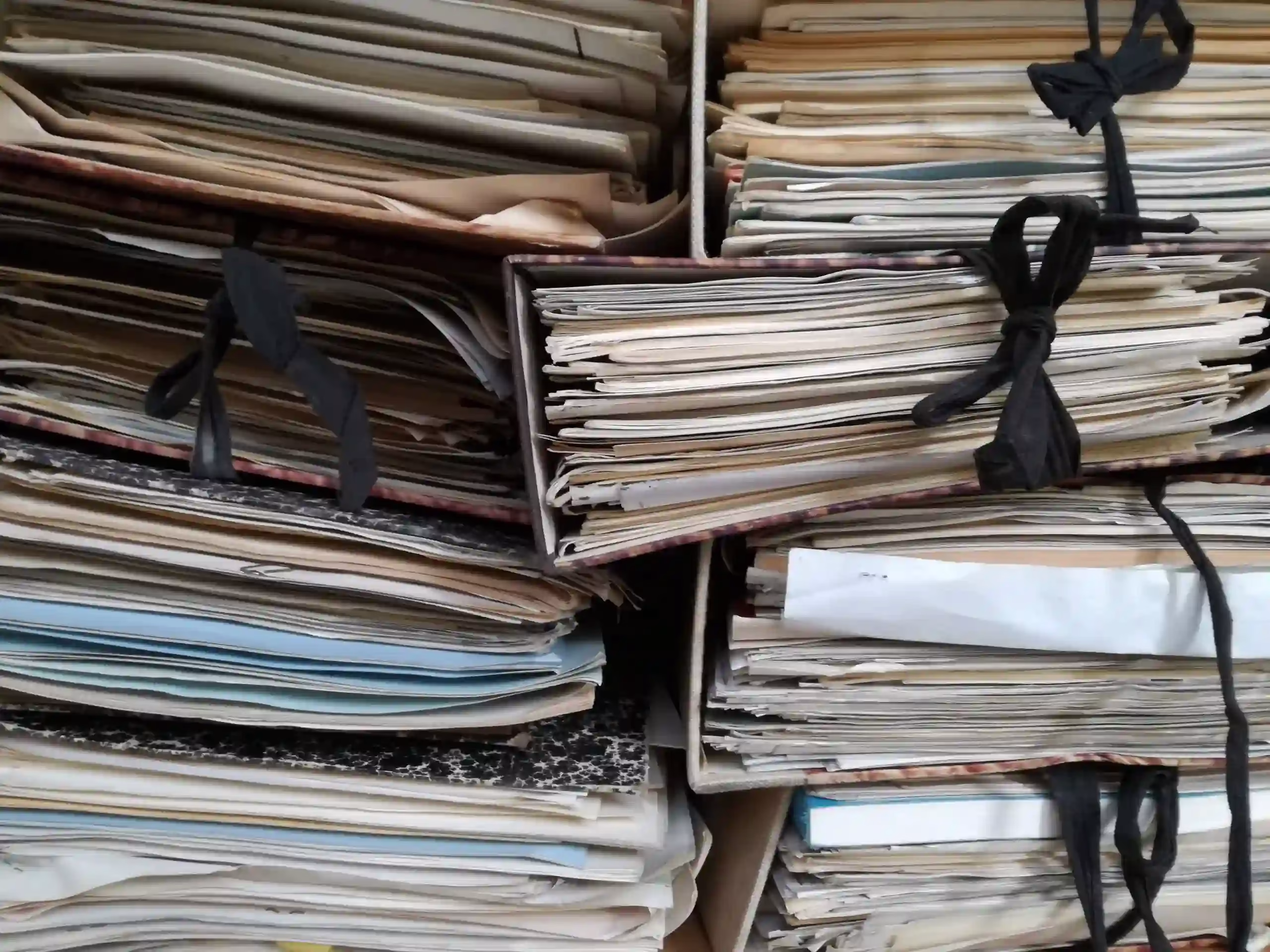 Messy stack of paper files