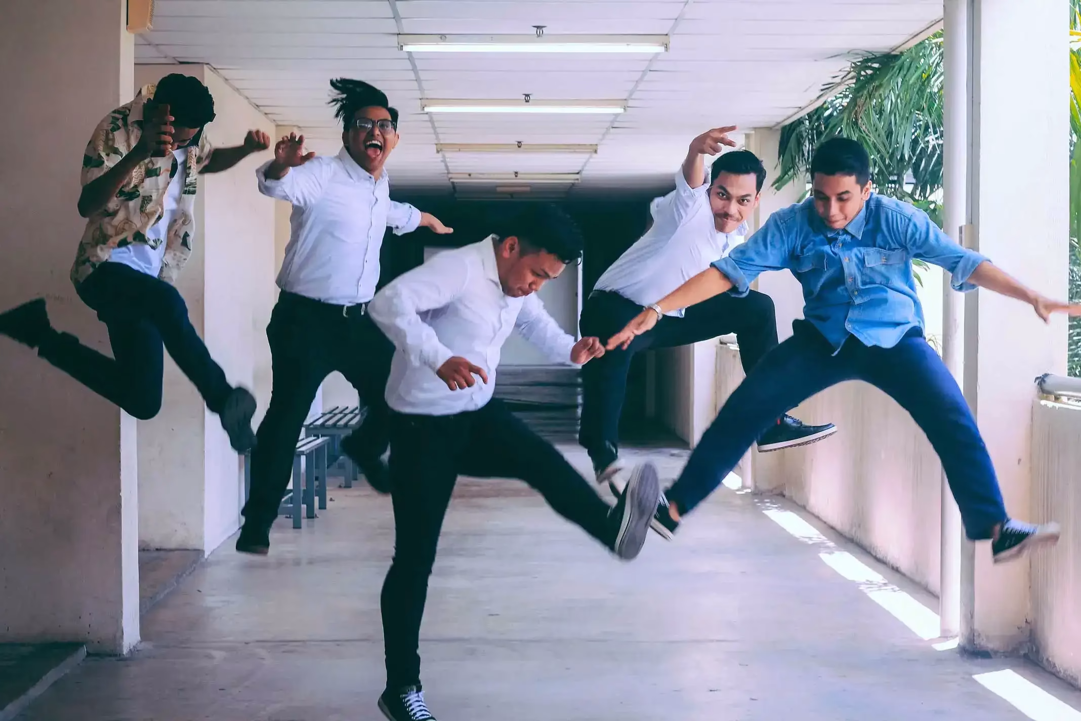 Group of happy individuals jumping in the air