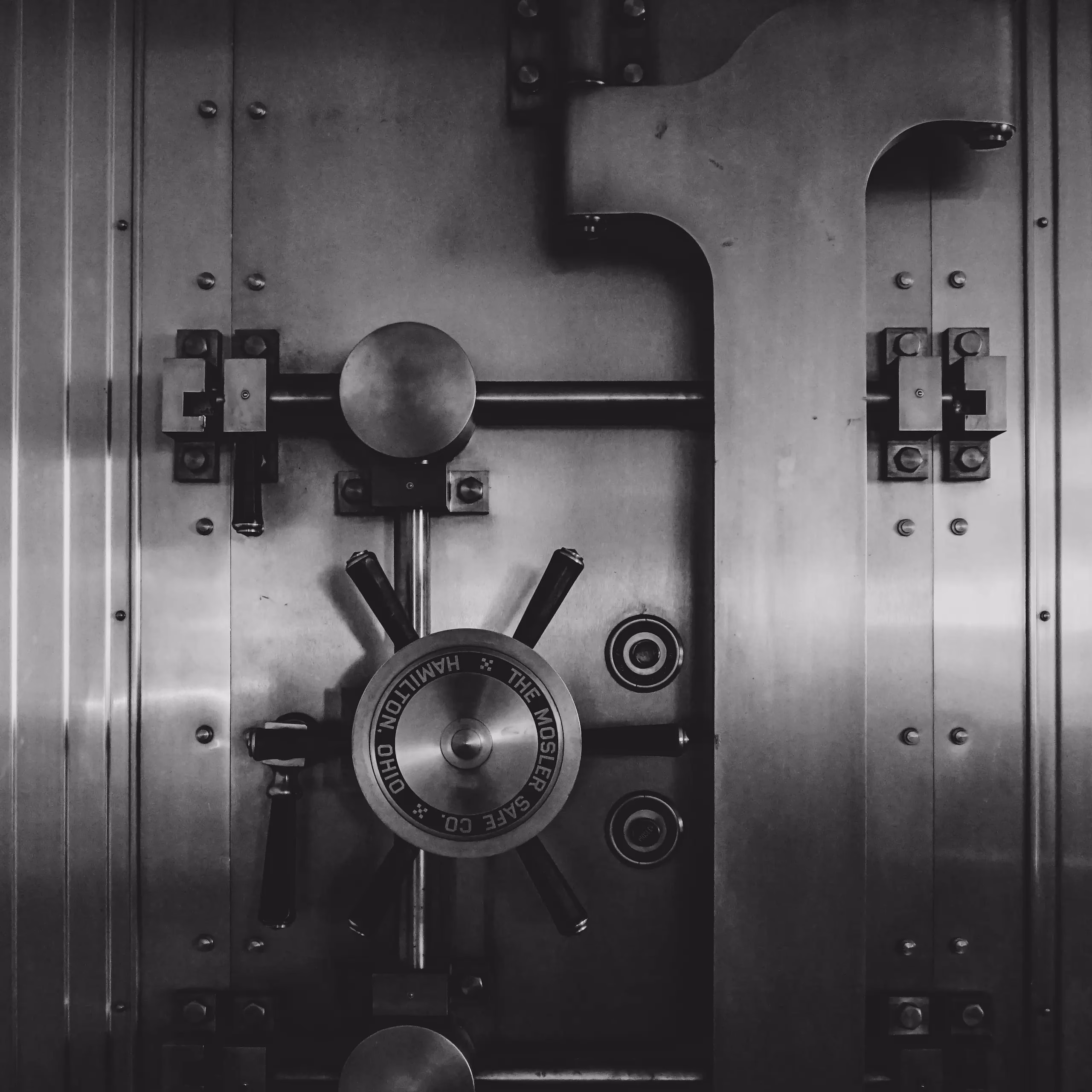Close up photo of a large vault door